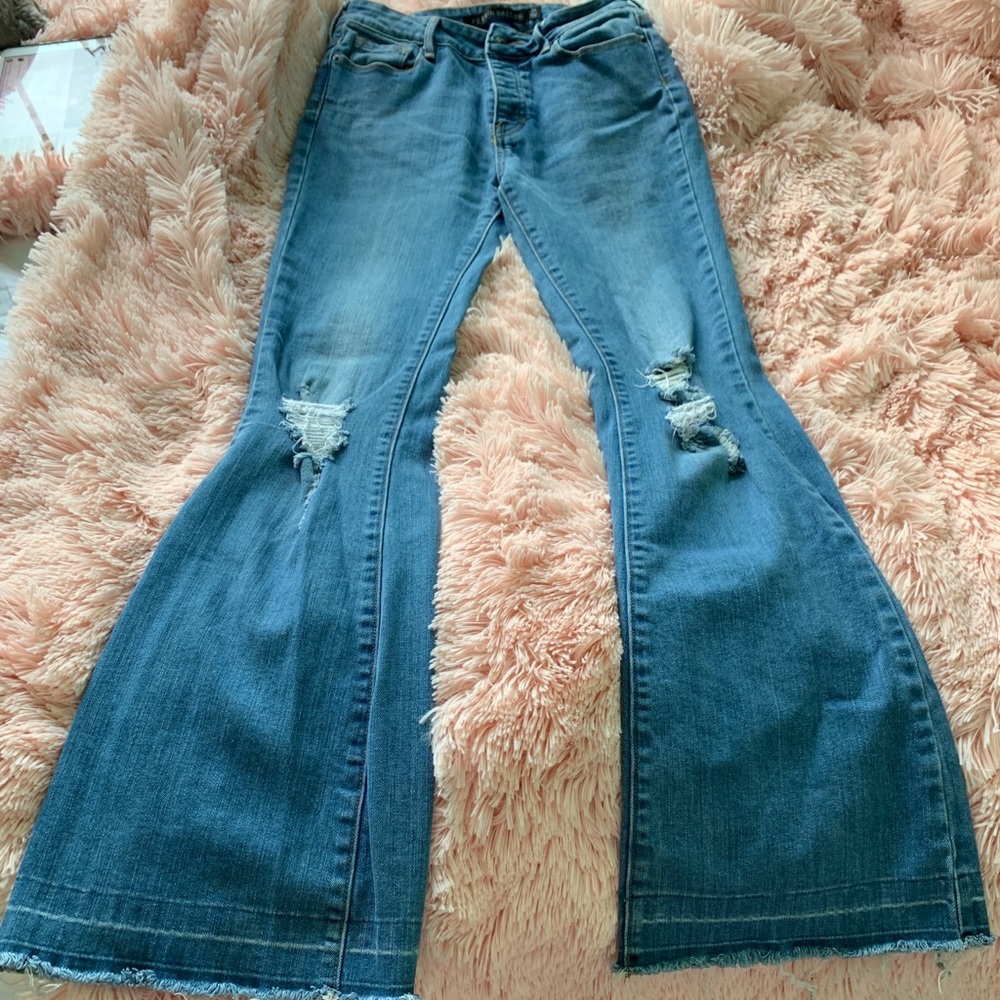 Distressed flared jeans